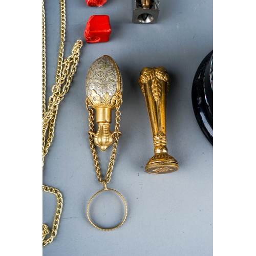 33 - A gilt metal chatelaine scent bottle; a brass seal with wax; a novelty cigar cutter depicting a figu... 