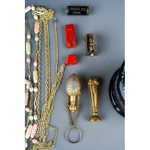 33 - A gilt metal chatelaine scent bottle; a brass seal with wax; a novelty cigar cutter depicting a figu... 