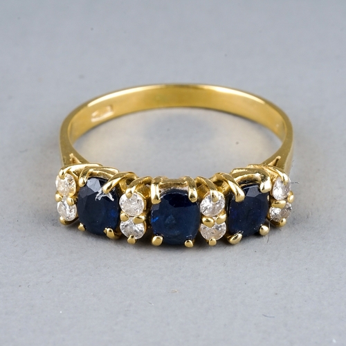 50 - An 18ct yellow gold sapphire and diamond ring, set with three oval-cut sapphires and eight round bri... 