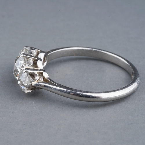 52 - A platinum and diamond three stone ring, set with old-cut diamonds, estimated total diamond weight a... 