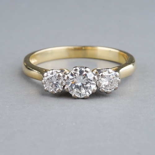 56 - An 18ct yellow gold and diamond three-stone ring, the centre round brilliant-cut diamond approx 0.40... 