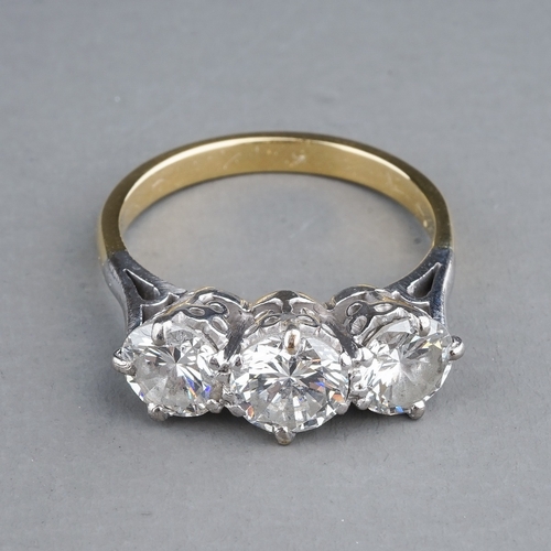 62 - A yellow gold and diamond three-stone ring, set with round brilliant-cut diamonds, centre stone appr... 