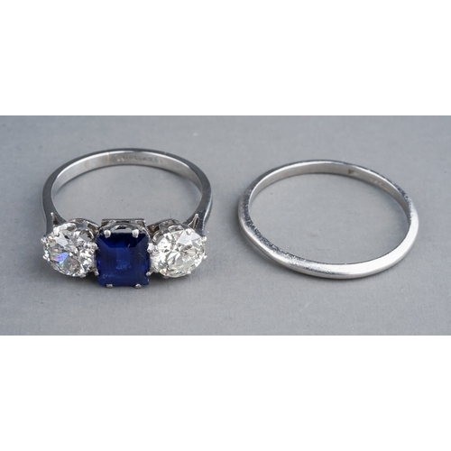 63 - An early 20th century platinum diamond and sapphire three-stone ring, the rectangular-cut sapphire f... 