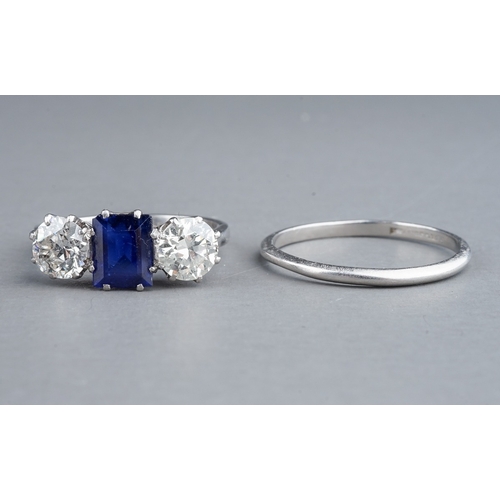 63 - An early 20th century platinum diamond and sapphire three-stone ring, the rectangular-cut sapphire f... 