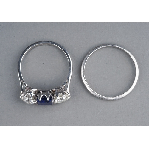 63 - An early 20th century platinum diamond and sapphire three-stone ring, the rectangular-cut sapphire f... 