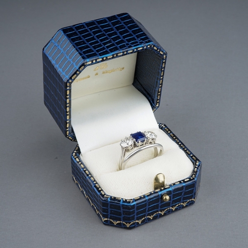 63 - An early 20th century platinum diamond and sapphire three-stone ring, the rectangular-cut sapphire f... 