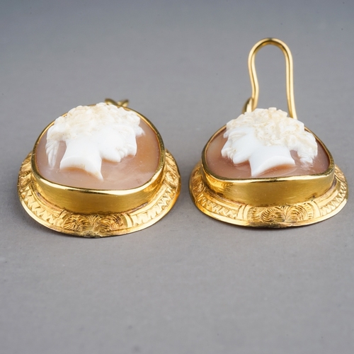 64 - A pair of 19th century yellow gold and cameo earrings, set with shell cameos carved depicting classi... 