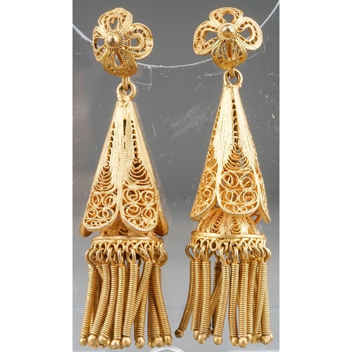 65 - A pair of 19th century yellow metal filigree earrings, tapered conical drops with tassels, hook fitt... 