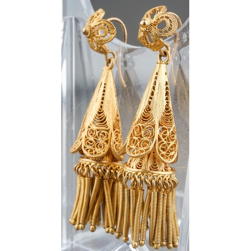 65 - A pair of 19th century yellow metal filigree earrings, tapered conical drops with tassels, hook fitt... 