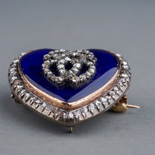 66 - A late 19th century diamond and enamel heart shaped brooch/pendant, the blue enamel heart set with t... 