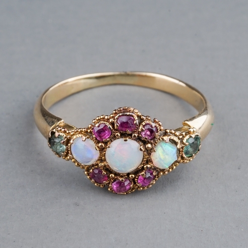 67 - An early 20th century yellow gold opal cluster ring, set with three round cabochon opals within a ru... 