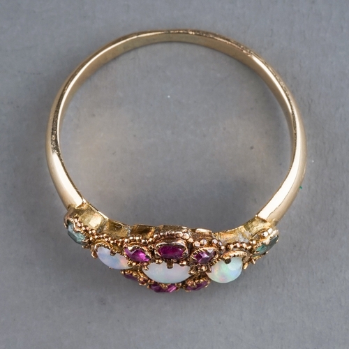 67 - An early 20th century yellow gold opal cluster ring, set with three round cabochon opals within a ru... 