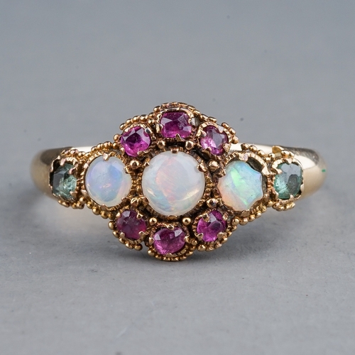 67 - An early 20th century yellow gold opal cluster ring, set with three round cabochon opals within a ru... 