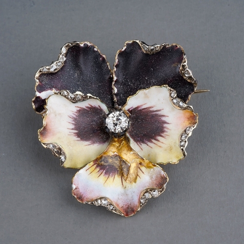 69 - A Victorian enamel and diamond pansy brooch, set with an old-cut diamond in polychrome enamel petals... 