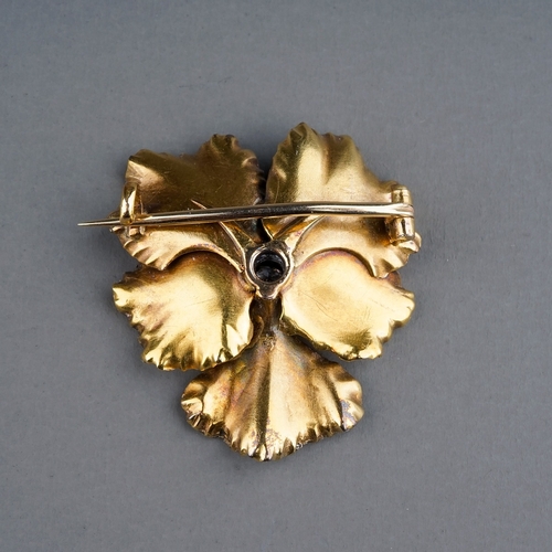 69 - A Victorian enamel and diamond pansy brooch, set with an old-cut diamond in polychrome enamel petals... 