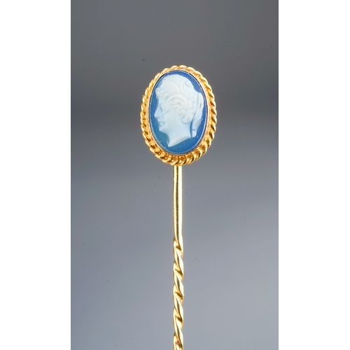 71 - A late 19th/early 20th century yellow gold cameo stick pin, set with an oval blue and white glass ca... 