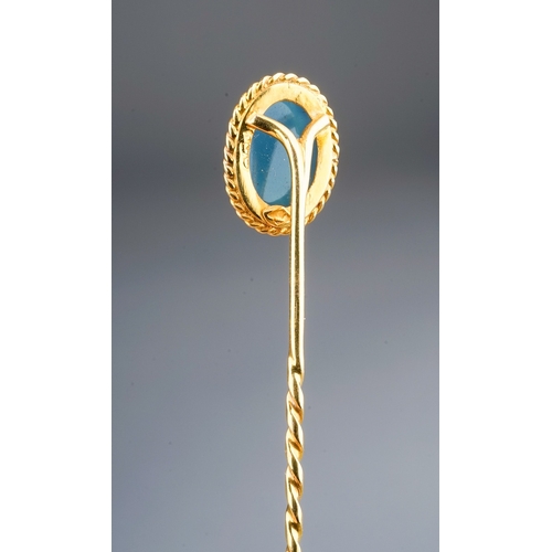 71 - A late 19th/early 20th century yellow gold cameo stick pin, set with an oval blue and white glass ca... 