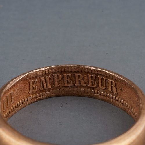 75 - A rose gold ring, of plain design, the inner shank inscribed 'NAPOLEON EMPEREUR III 1861', size R, g... 