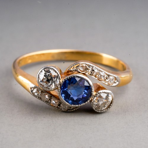 84 - An early 20th century sapphire and diamond ring, set with a sapphire flanked by two old-cut diamonds... 