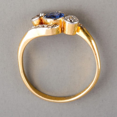 84 - An early 20th century sapphire and diamond ring, set with a sapphire flanked by two old-cut diamonds... 