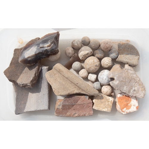 113 - A small tray of musket/flint lock ballshot a neolithic arrow head early pottery fragments and a flin... 