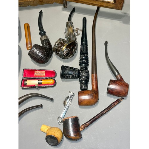 120 - A collection of pipes to include Meerschaum - one cased Gentleman wearing a turban; another of a man... 