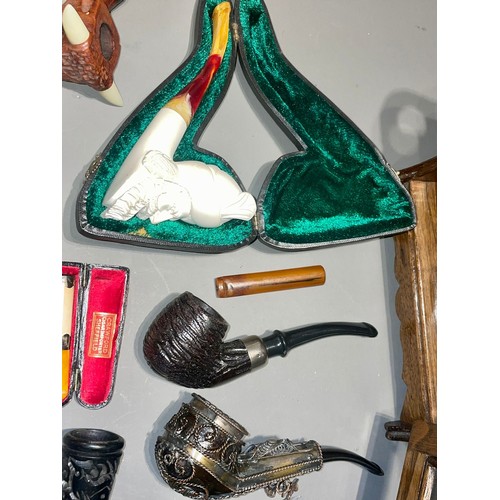 120 - A collection of pipes to include Meerschaum - one cased Gentleman wearing a turban; another of a man... 