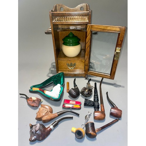 120 - A collection of pipes to include Meerschaum - one cased Gentleman wearing a turban; another of a man... 