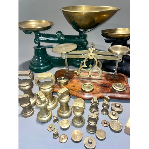 123 - Three early 20th Century brass mounted weighing scales with various weights (a/f)