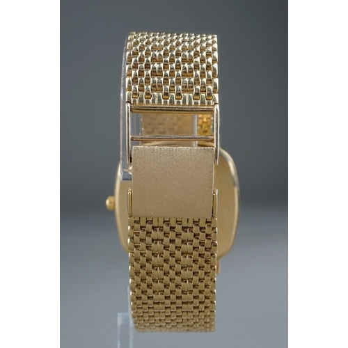 176 - A 9k yellow gold Geneve wristwatch, 27mm white square dial, 30mm case, integral 9k gold bracelet str... 