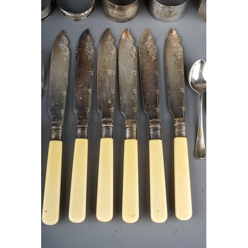 180 - A collection of seven various 20th Century silver napkin rings and spoons, various dates and makers,... 