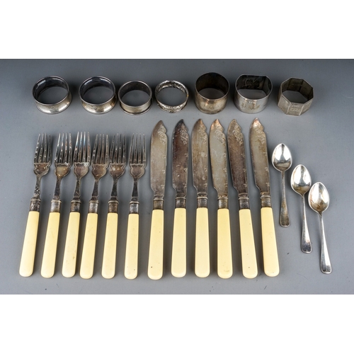 180 - A collection of seven various 20th Century silver napkin rings and spoons, various dates and makers,... 