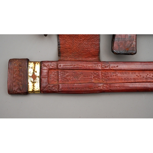 218 - The first in red leather which matches the cross guard, the handle being darker leather, blade in go... 