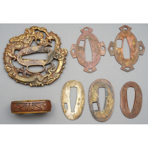 228 - Seven brass pieces which look to have belonged to a Japanese Sword.