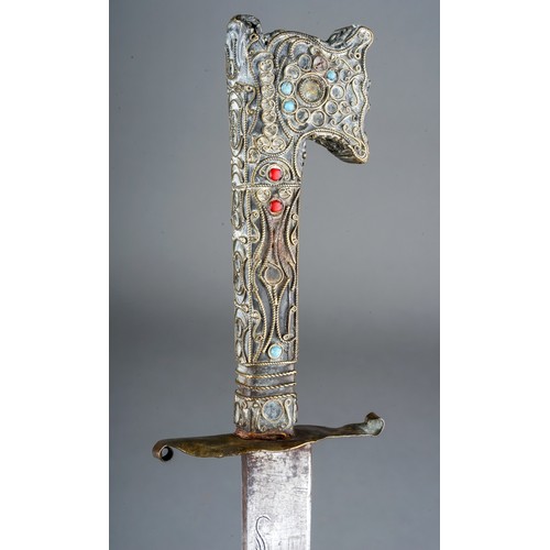 235 - Antique Moroccan Nimcha dagger, wire work hilt set with turquoise and red stones.  Length 39cm