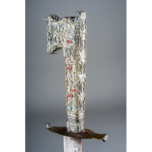 235 - Antique Moroccan Nimcha dagger, wire work hilt set with turquoise and red stones.  Length 39cm