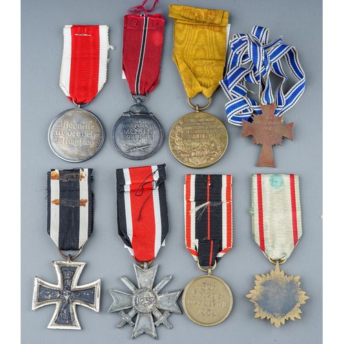 242 - A collection of 8 German Medals.  Eastern Front Medal, Mothers Cross in Bronze, War Merit Medal, Soc... 