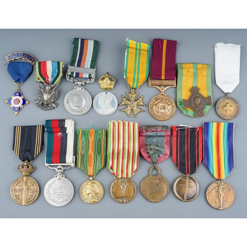 245 - A collection of World Medals.  15 in total, France, Belgium, Pakistan etc.  Conditions VF+