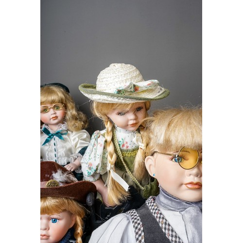 297 - A collection Modern decorative dolls and associated furniture