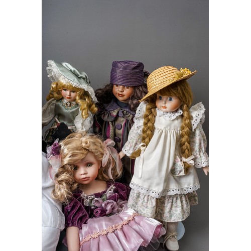 297 - A collection Modern decorative dolls and associated furniture