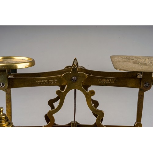 313 - An early 20th Century brass mounted Postal Rate scales for Letters with various weights, approx 23cm... 