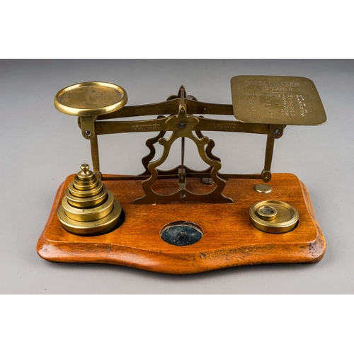 313 - An early 20th Century brass mounted Postal Rate scales for Letters with various weights, approx 23cm... 