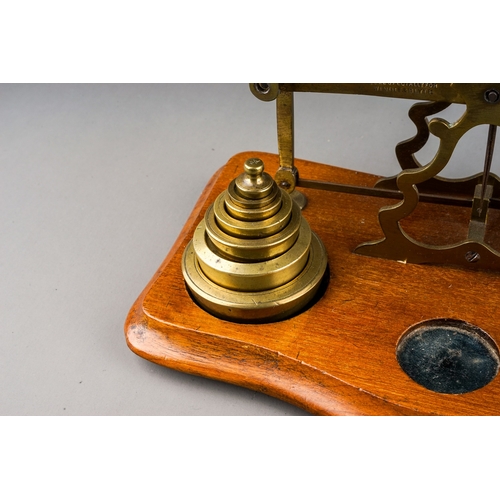 313 - An early 20th Century brass mounted Postal Rate scales for Letters with various weights, approx 23cm... 