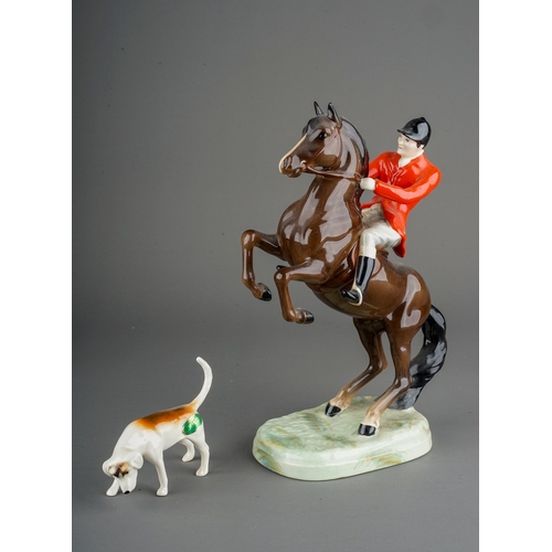 328 - A Beswick model no 868 of a huntsman on a rearing brown horse, printed and impressed marks to base, ... 