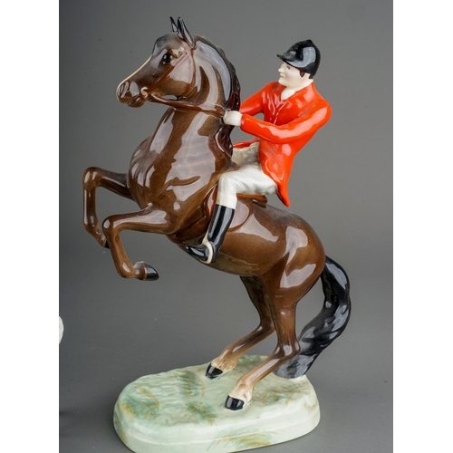 328 - A Beswick model no 868 of a huntsman on a rearing brown horse, printed and impressed marks to base, ... 