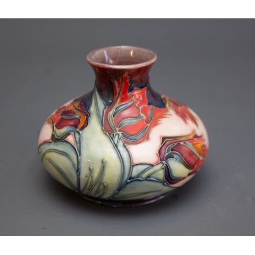 349 - A Moorcroft Red Tulip squat vase with WM monogram and printed marks to base, 11cm high.