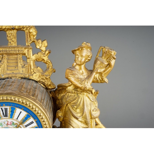 352 - A French gilt spelter porcelain mounted mantle clock, the drum movement with Sevres style dial Roman... 