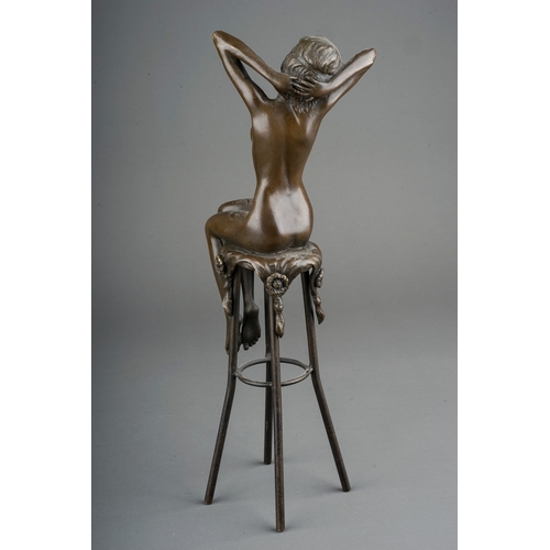 381 - In the manner of Chiparus, a modern bronze of a seated female nude, approx 27cm high