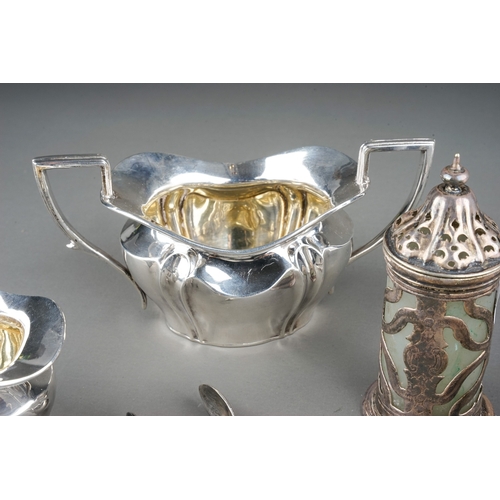 382 - A group of silver to include: Edwardian monogrammed milk jug and sugar bowl, by Robert Pringle, Lond... 