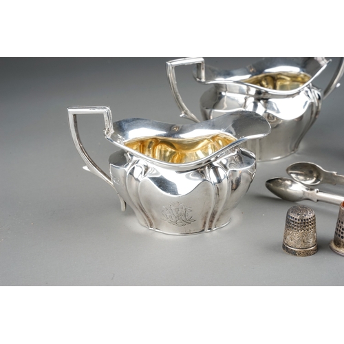 382 - A group of silver to include: Edwardian monogrammed milk jug and sugar bowl, by Robert Pringle, Lond... 